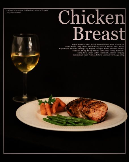 Grilled chicken breast on a plate with carrots and green beans, alongside a glass of white wine.