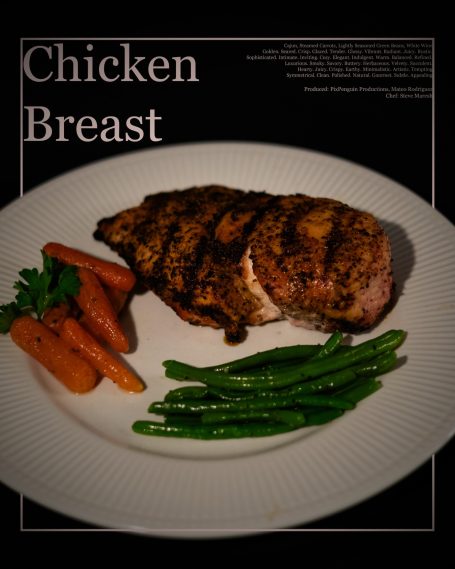 Grilled chicken breast served with carrots and green beans on a white plate.